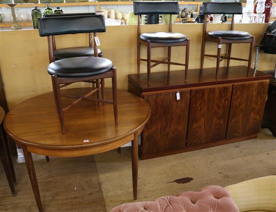 G-Plan rosewood extending dining table and four chairs and a matched sideboard